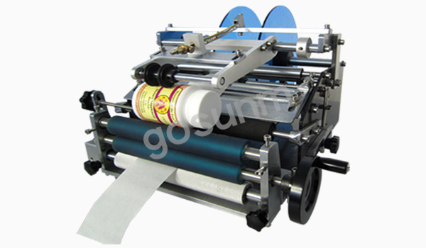 手動(dòng)圓瓶貼標(biāo)機(jī) 手動(dòng)圓瓶貼標(biāo)機(jī)